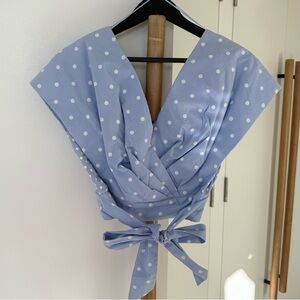 Blue Polka Dot Top with a tie at the waist. New condition, but no tag. XS size.